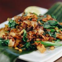 Pad See You · Chargrilled stir-fried flat rice noodles with eggs, Asian broccoli, and your choice of prote...