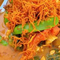 Yellow Curry · Yellow coconut curry with your choice of protein, potatoes, carrots, onions, topped with fri...