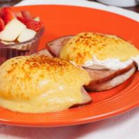 Egg Benedict · Two poached eggs and ham on a English muffin. Topped with hollandaise sauce.