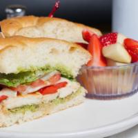 Grilled Chicken Sandwich · Grilled chicken breast with mozzarella, pesto, roasted red peppers. Lettuce and tomato. Serv...
