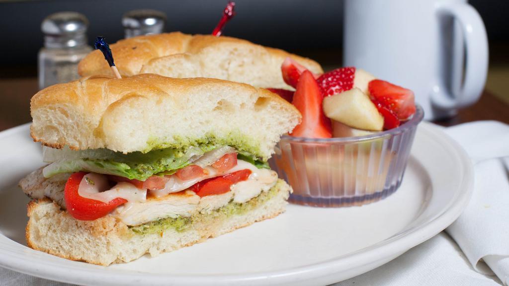 Grilled Chicken Sandwich · Grilled chicken breast with mozzarella, pesto, roasted red peppers. Lettuce and tomato. Served on focaccia.