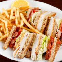Turkey Club Sandwich · Turkey, bacon, cheddar cheese, lettuce, tomato, mayo and mustard.