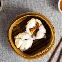 Steamed BBQ Pork Bun 叉燒包 · Pork wrapped in large dumpling skin and steamed to perfection.