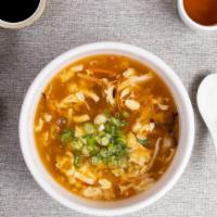 Hot & Sour Soup 酸辣湯 · Bamboo shoots, soy sauce, chili garlic, mushrooms in a spicy blend.