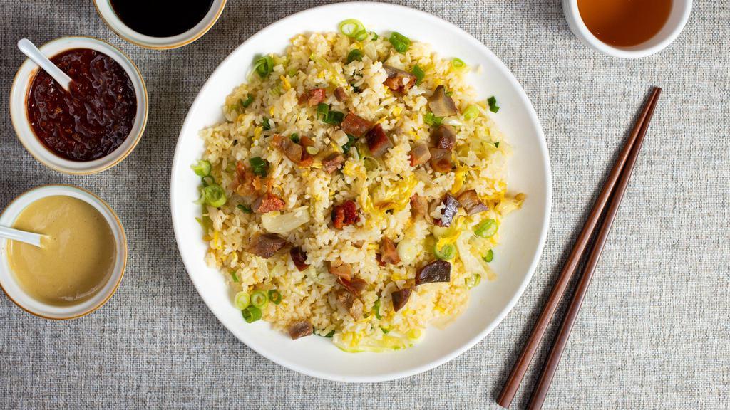 Pork Fried Rice 叉燒炒飯 · Pork and veggies stir-fried and cooked with rice.