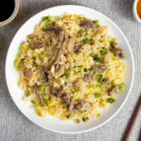 Beef Fried Rice 牛炒飯 · Beef and veggies stir-fried and cooked with rice.