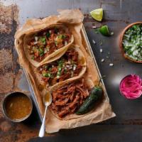 La Chingona · Our badass tacos with slow-cooked, shredded protein of your choice, fresh diced onion & cila...