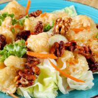 A. Walnut Prawns · Semi-crisp prawns with honey roasted walnuts in our special sweet cream sauce with a touch o...
