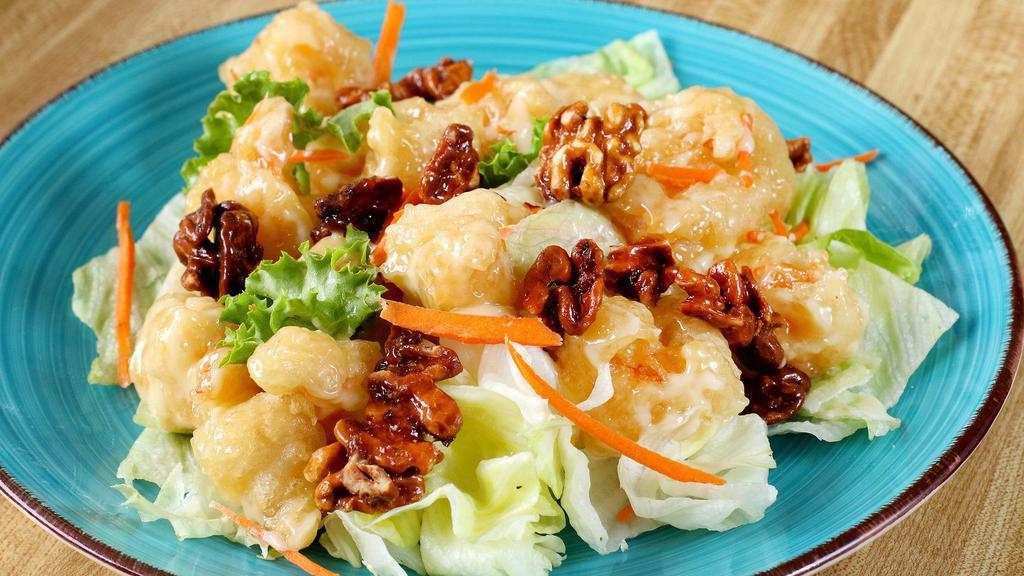 A. Walnut Prawns · Semi-crisp prawns with honey roasted walnuts in our special sweet cream sauce with a touch of lemon.