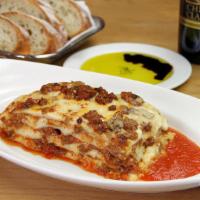 Lasagna Ferrarese · Housemade fresh pasta sheets layered with meat ragu, porcini mushrooms, Grana Padano & bécha...