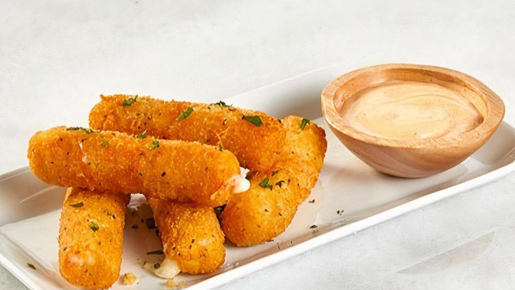 Mozzarella Sticks · Crisp breaded mozzarella sticks served with your choice of dipping sauce.