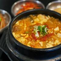 T8. Kimchi Soft Tofu Soup · Organic Tofu boiled with kimchi and beef or pork.
