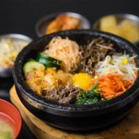 B6. Kimchi Beef Stoneware Bibimbab · Rice, kimchi, beef, egg, and vegetables.