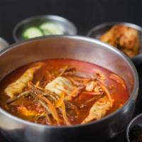 S4. Dumpling Yook Gae Jang · Spicy. Spicy soup with dumpling, beef, glass noodles, vegetables, and egg. Served with rice.