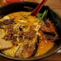 B11. Tan Tan Ramen Combo · With roast pork and pork bell,  house made minced pork with varieties of chili and pepper sa...