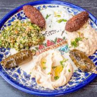 Cold Mezza Combo · Hummus, baba ghanouj, falafel, dolma, labneh, and taboulah.