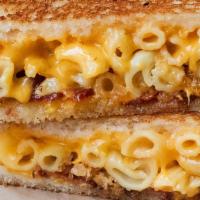 Mac Daddy · Creamy mac ‘n’ cheese, aged cheddar, smoked bacon on artisan french bread. Includes pickle o...