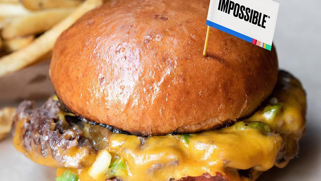 Impossible MeltBurger · Our signature MeltBurger made with an Impossible™ plant-based patty that looks & tastes just like beef. Loaded with melted cheddar, jalapeño-pickle mix (not too spicy, we promise) and Melt sauce on a toasted, artisan bun.