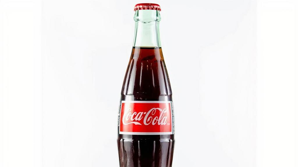 Mexican Coke · Iconic refreshing cola.
