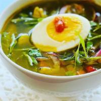 Aguadito De Pollo · Traditional Peruvian cilantro soup made with our rotisserie pollo, rice, veggies, slice egg ...