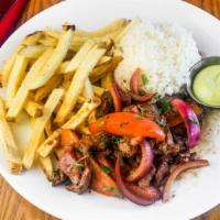 Lomo Saltado · Sautéed with balsamic soy sauce tenderloin steak. Mixed with red onions, tomatoes, and cilan...