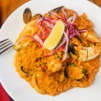 Arroz Con Mariscos · Peruvian style paella, calamari, octopus, scallops, shrimp, clams, mussels, crab claw, aji p...