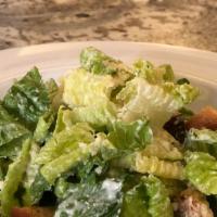 Caesar · Romaine lettuce, parmesan reggiano, garlic croutons and house dressing.
