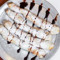 Pow Pows Twisted Sticks · Calories 460. Baked dough “twisted” with a hazelnut sauce, powdered sugar and chocolate sauce.