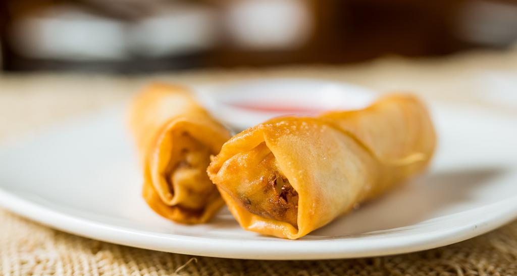 Veggie Spring Rolls (4) · With sweet & sour sauce.