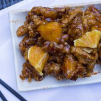 Orange Chicken · Sweet and spicy orange sauce and orange chunks. comes with soup eggroll and choice of rice.
