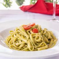 Fettuccine alla Genovese · Fettuccine pasta in our house made traditional pesto sauce (fresh basil, parmesan cheese, pi...