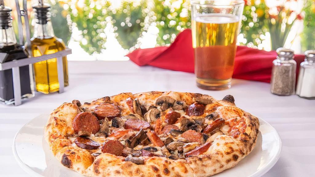 Nonno Francesco Pizza Regular · House made pizza sauce, mozzarella cheese, house made Italian pork sausage, and mushrooms (10