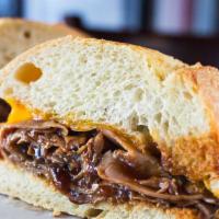 Johny Roast Beef · Hot roast beef with BBQ sauce and melted cheddar cheese.