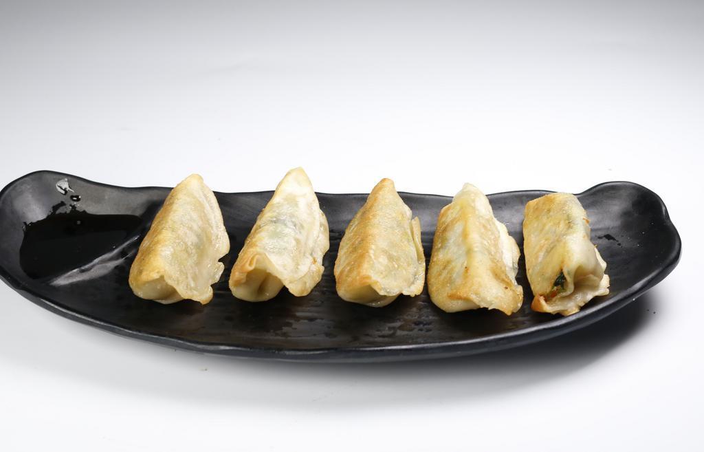 A7. Vegetable Gyoza · Pan-fried vegetable pot stickers.
