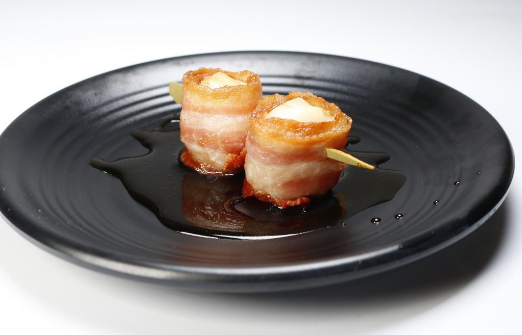 A26. Scallops Wrapped with Bacon · Crispy fried scallop wrapped with bacon.