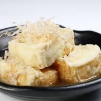 A6. Agedashi Tofu · Japanese fried tofu in house sauce.