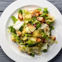 Caesar Salad · Lettuce, croutons, and shaved parmesan cheese with a side of Caesar dressing.