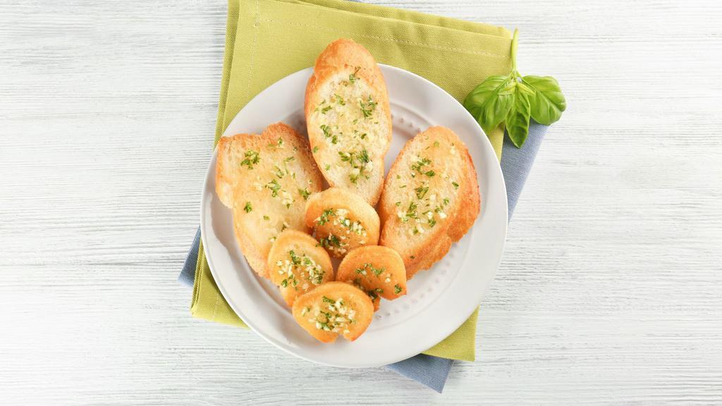 Garlic Bread · 1/2 loaf of fresh made garlic bread with a side of marinara.
