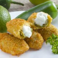Jalapeno Poppers · Jalapenos stuffed with warm cream cheese.