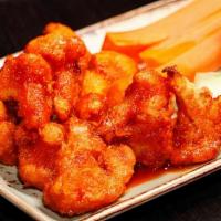 Cauliflower Wings · Guinness beer-battered and tossed in spicy sauce and served with herb ranch.
