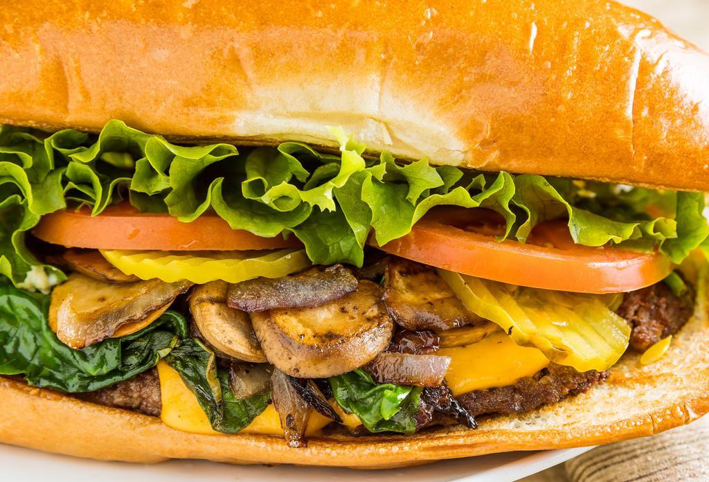 Richmond King Burger · Inspired by the local blues/rock and roll band from the Richmond district. 1/3 lb burger on a soft French roll, topped with spinach, grilled mushrooms, onions and cheddar cheese.