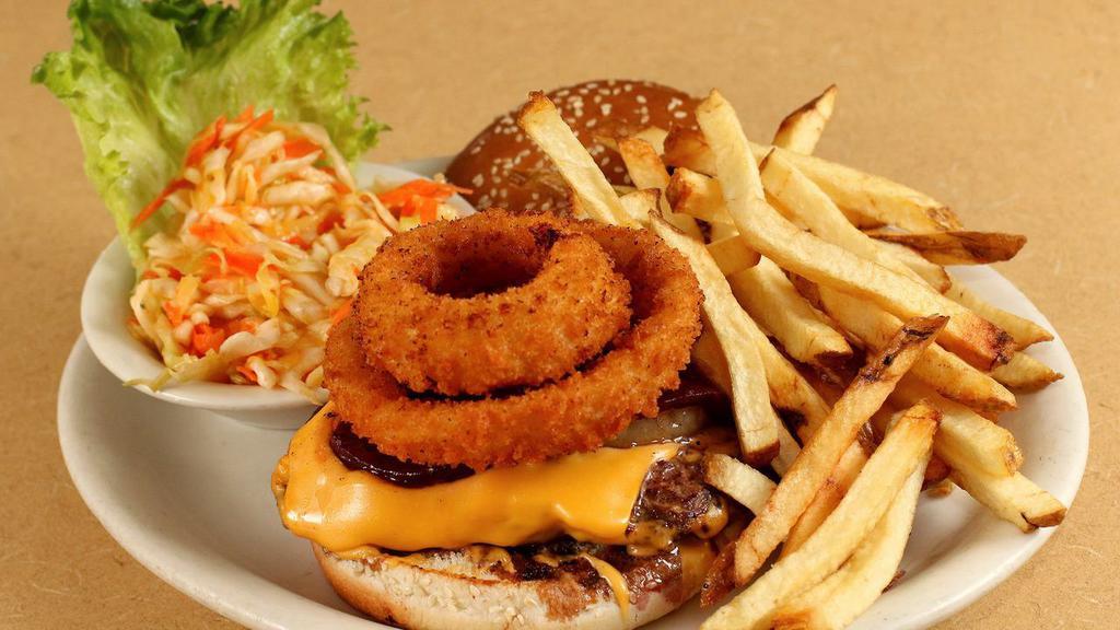 Chantastic · Named after CBS Channel 5 TV personality Lisa Chan. An American cheeseburger topped with two onion rings, sliced beets, sliced pineapple, and coleslaw.