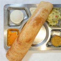 Masala Dosa · Thin rice and lentil crepe filled with mildly spiced mashed potatoes and onions