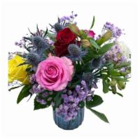 Deluxe Mix Roses Arrangement.  · Our very elegant Roses Deluxe Arragement will make that special one so special. this bright ...