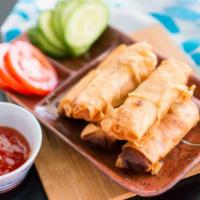 Egg Rolls with Cucumber Slices 素炸春卷伴青瓜 · Crispy dough filled with minced vegetables.