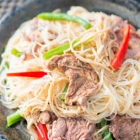 Taiwanese Barbecued Sauce Beef 沙茶牛肉燜米粉 · With rice noodles.