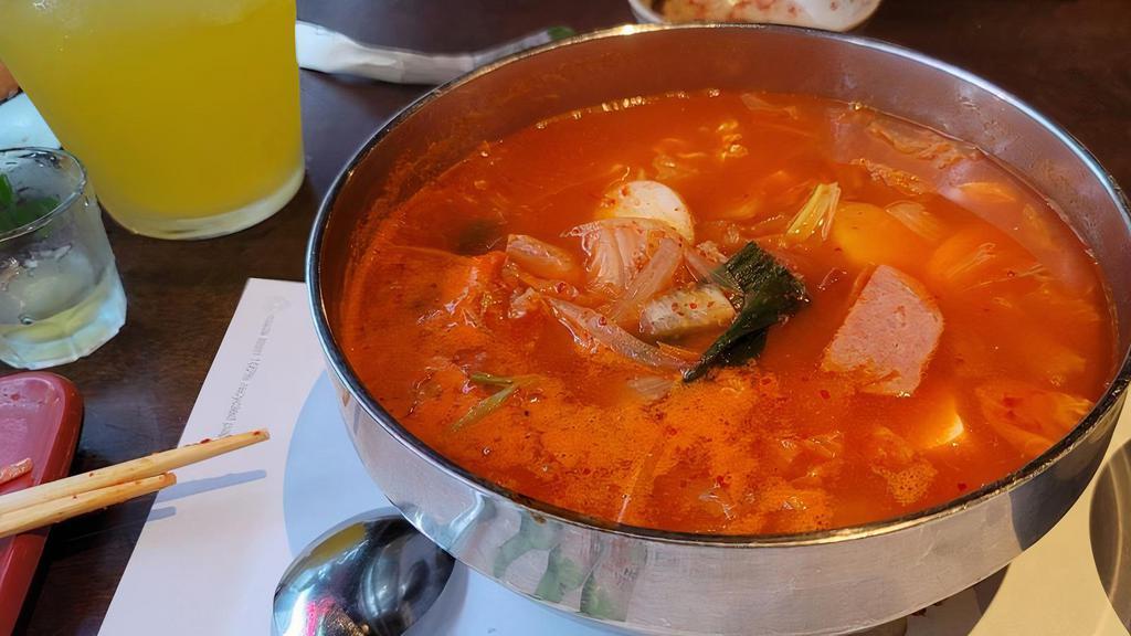Army soup (Regular size) · Mild spicy. Kimchi hotpot with ramen, sausages and ham.