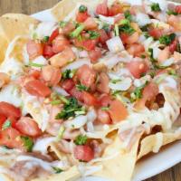Meat Nachos · Chips, beans, cheese, meat and salsa.