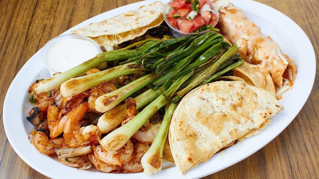 Fiesta Platter · Serves 2-4 persons. Nachos, garlic prawns, chicken flauta, corn quesadilla, grilled onions, guacamole, sour cream and salsa.