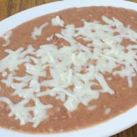 House Crafted Refried Beans with Melted Cheese · Serves 3-5 persons. With house made Maiz chips.